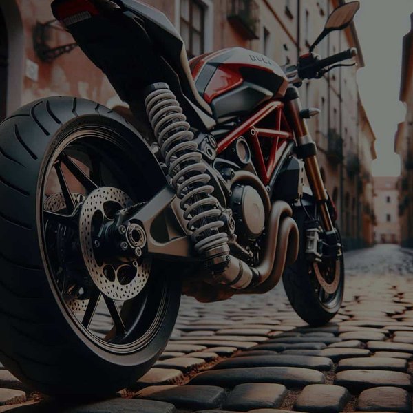 Quels réglages de suspensions privilégier pour une Ducati Monster 797 sur routes pavées ?